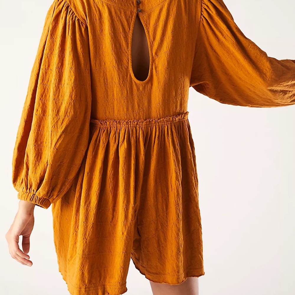 Free people beyond obsessed romper in golden palm